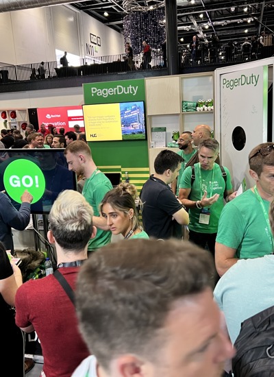 People talking at the PagerDuty tradeshow booth