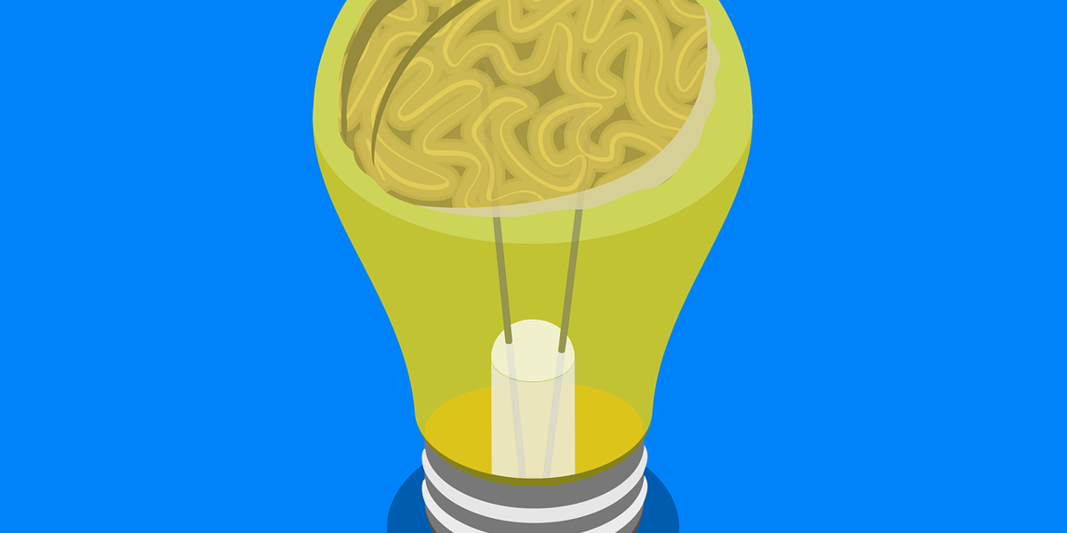 Lightbulb containing a brain, symbolizing the psychology behind community engagement at events