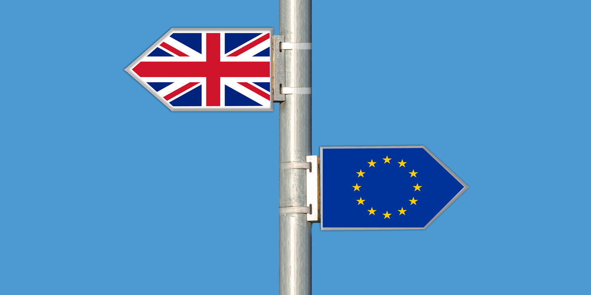 Two arrows, one of the union jack flag and the other of the European union flag. Both images symbolising Brexit.