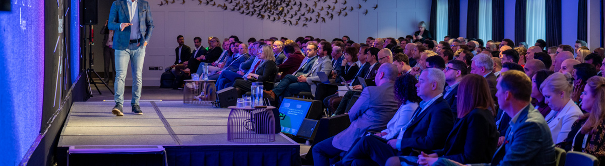 Audience watching a speaker on the stage at the Boomi World Tour event in London