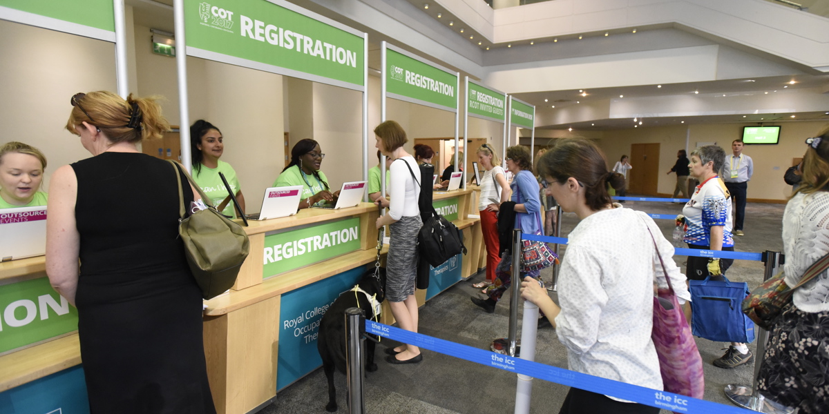 Delegates attending the registration desk at RCOT conference