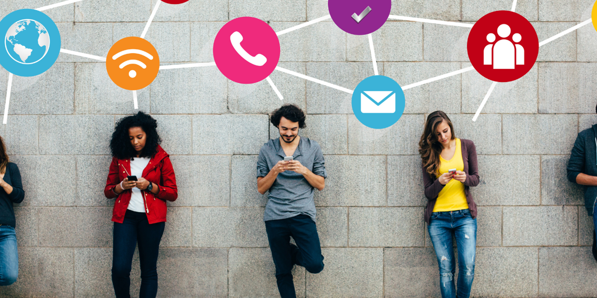 People standing against a wall using mobile phones with digital icons like globe, Wi-Fi, profiles, and telephone symbols emanating from their devices, representing global connectivity and communication.