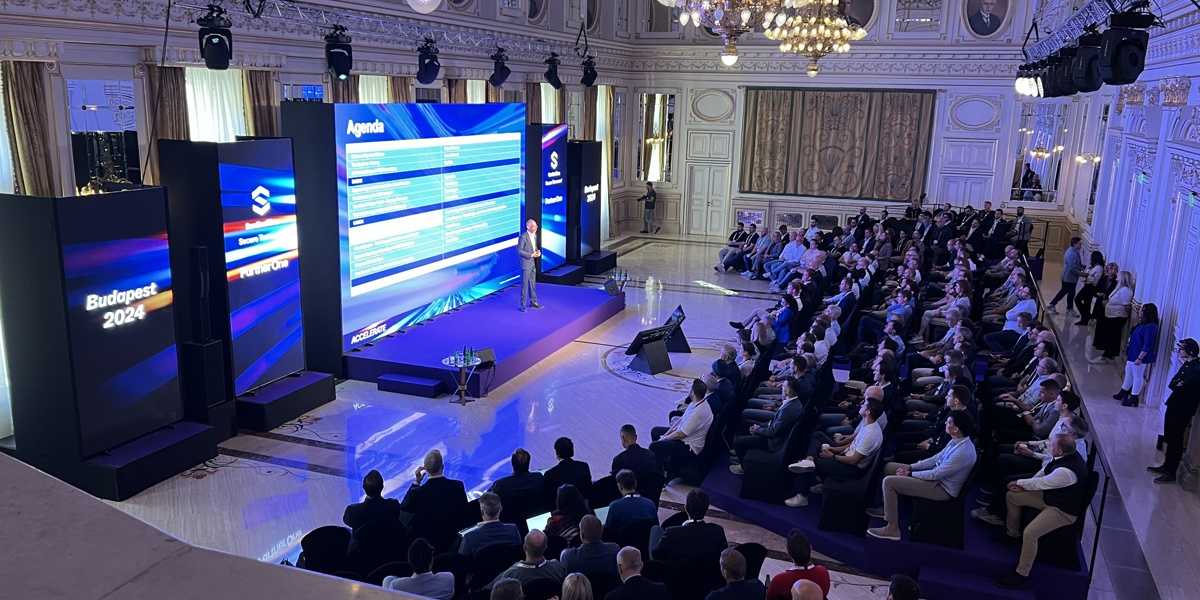 Audience at the Sentinel One Budapest conference watching the speaker on the stage presenting