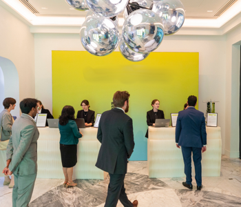 Guests at sustainable paper registration desks at an AI technology awards dinner in London