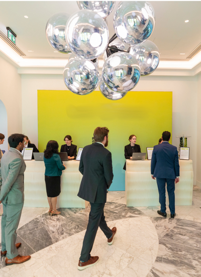 Guests at sustainable paper registration desks at an AI technology awards dinner in London
