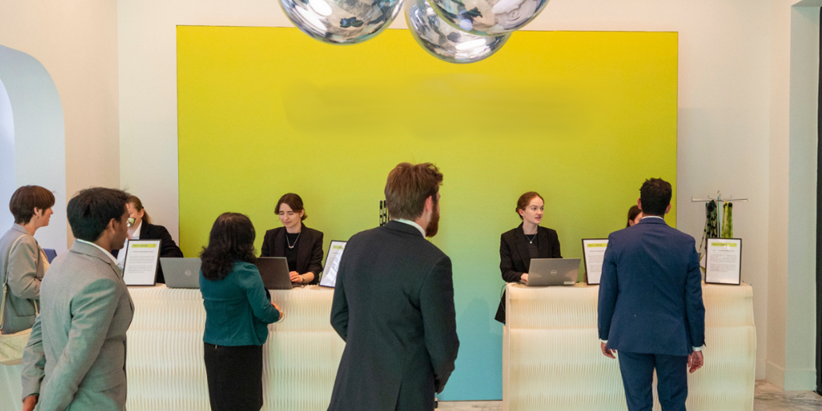 Guests at sustainable paper registration desks at an AI technology awards dinner in London