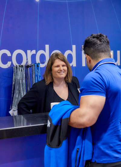 People talking at the Recorded Future event registration desk